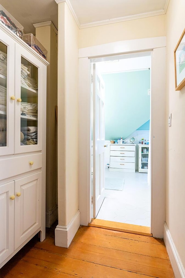 50 Peters Rd, Searsmont, ME 04973 - hall with ornamental molding, baseboards, and light wood-type flooring