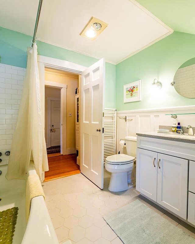 50 Peters Rd, Searsmont, ME 04973 - full bath featuring shower / tub combo, vanity, ornamental molding, a wainscoted wall, and toilet