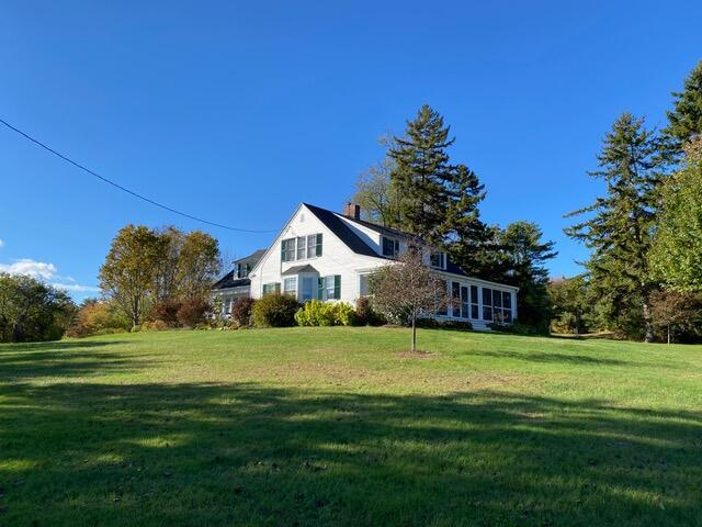 50 Peters Rd, Searsmont, ME 04973 - exterior space with a front yard and a chimney