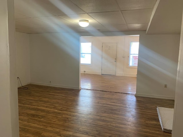 entryway featuring dark wood-type flooring and a paneled ceiling