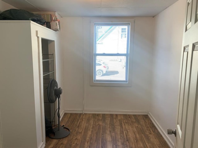 laundry room with dark hardwood / wood-style floors