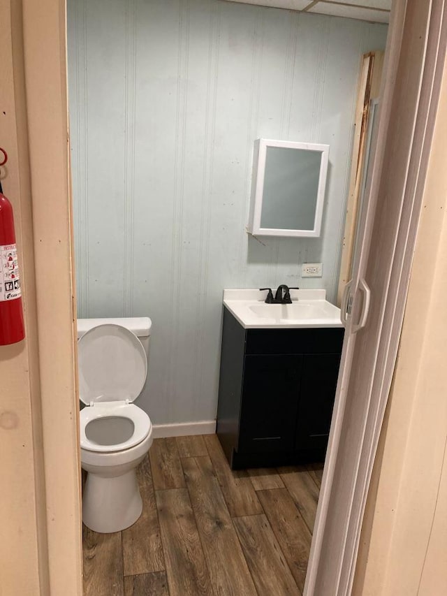 bathroom featuring toilet and vanity