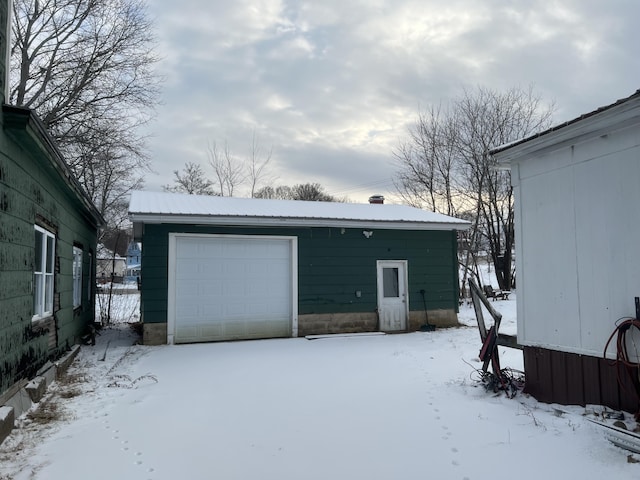 view of snow covered garage