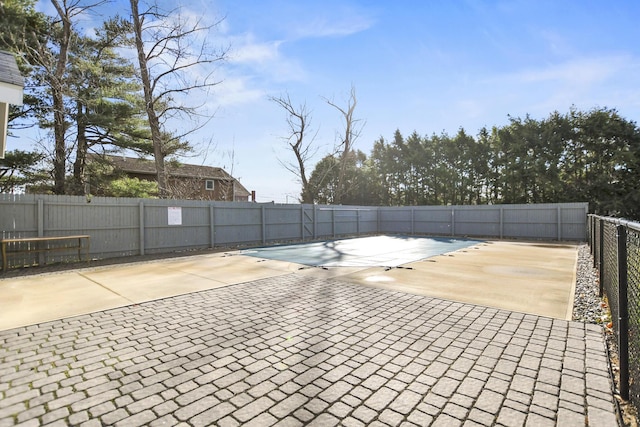 view of swimming pool featuring a patio