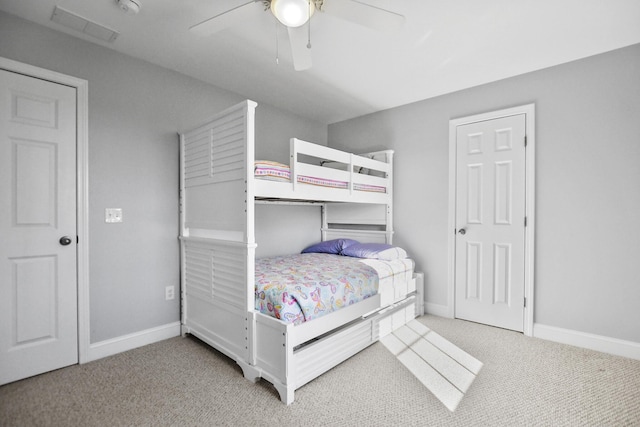 bedroom featuring ceiling fan and light carpet