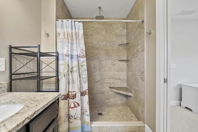 bathroom with vanity, tile patterned flooring, and curtained shower