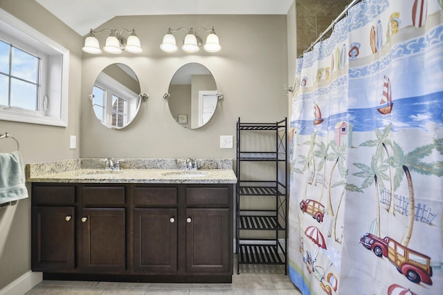 bathroom featuring vanity, tile patterned flooring, and a shower with curtain