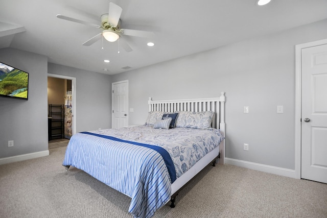 bedroom with ceiling fan and light carpet