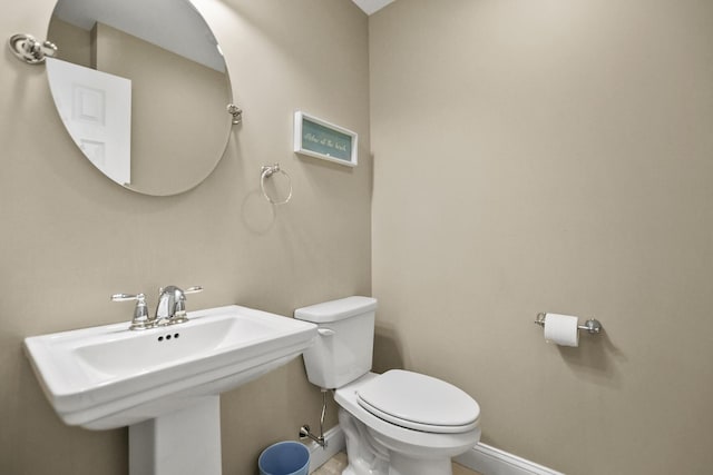 bathroom featuring sink and toilet