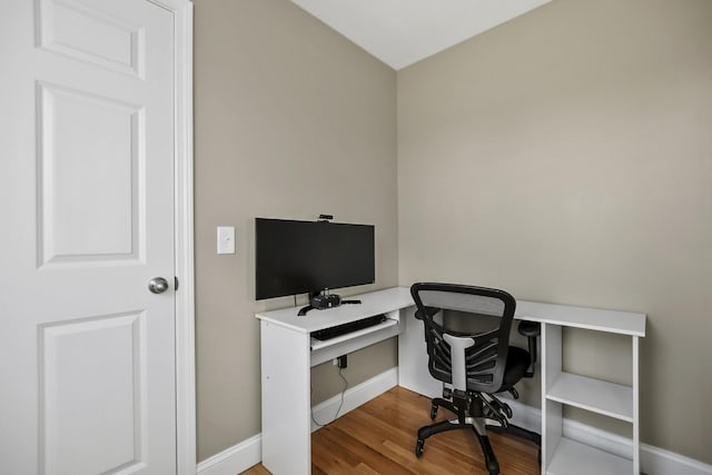 home office with hardwood / wood-style floors