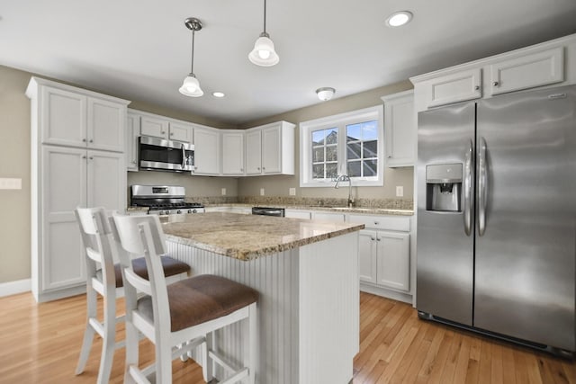 kitchen featuring sink, white cabinetry, and appliances with stainless steel finishes