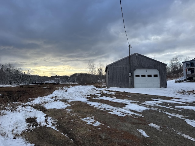 view of snow covered garage