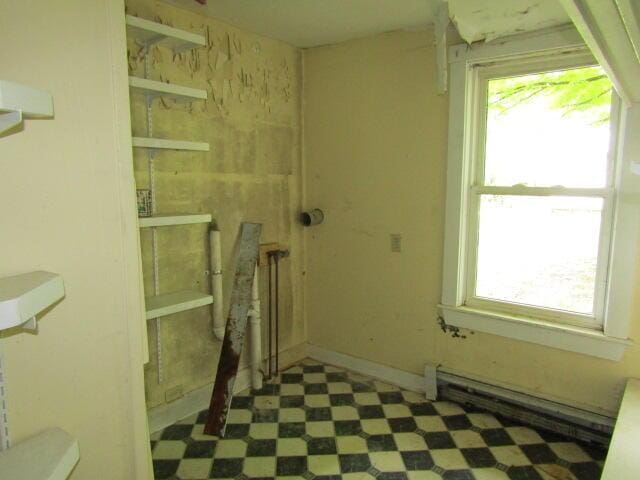 washroom with a baseboard radiator