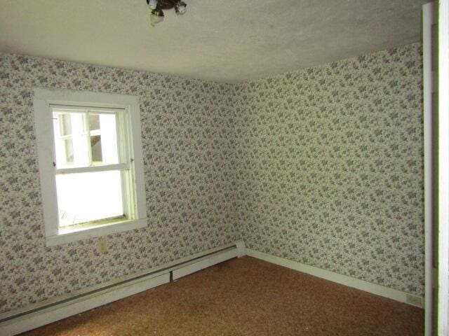 spare room with baseboard heating