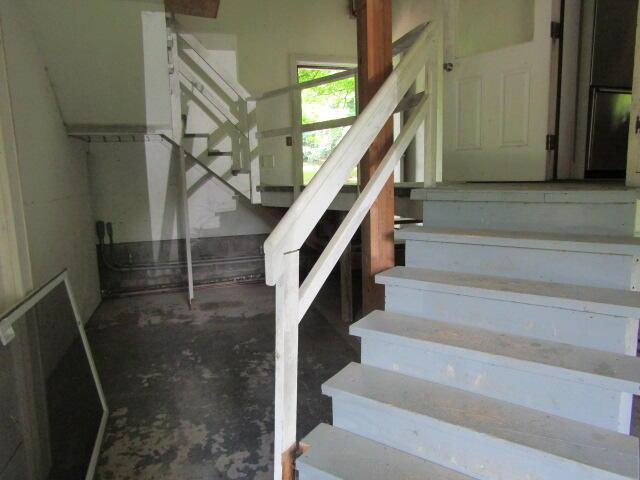 stairs with concrete floors