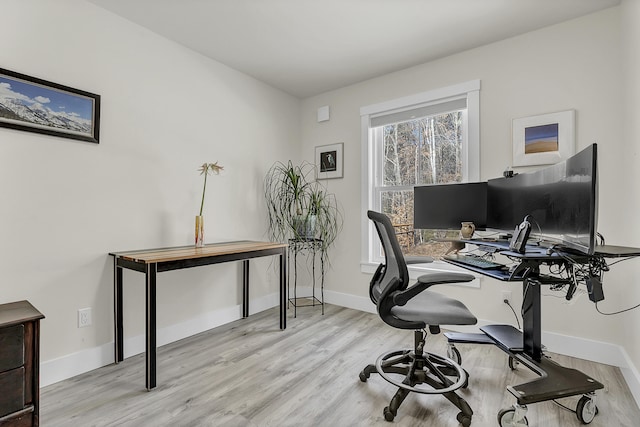 office with light hardwood / wood-style flooring