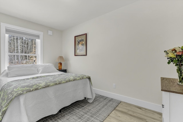 bedroom with light hardwood / wood-style flooring