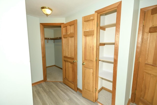 hall featuring light hardwood / wood-style flooring