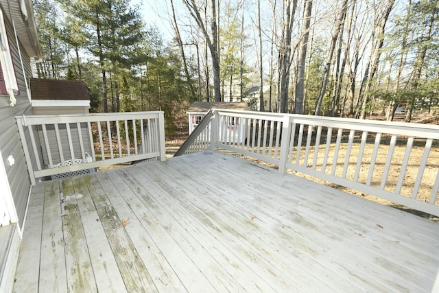 wooden deck with a storage unit