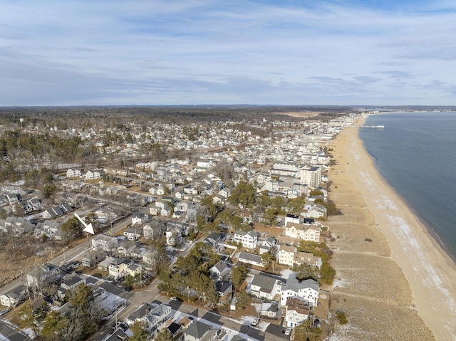 birds eye view of property featuring a view of the beach and a water view