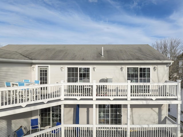 rear view of property featuring a garage