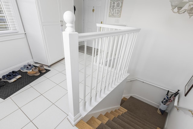 staircase with tile patterned floors