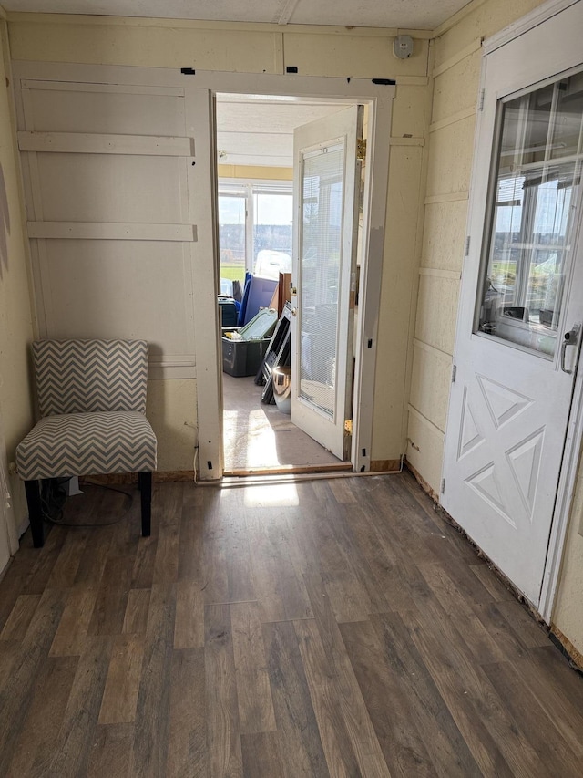 entryway with wood finished floors