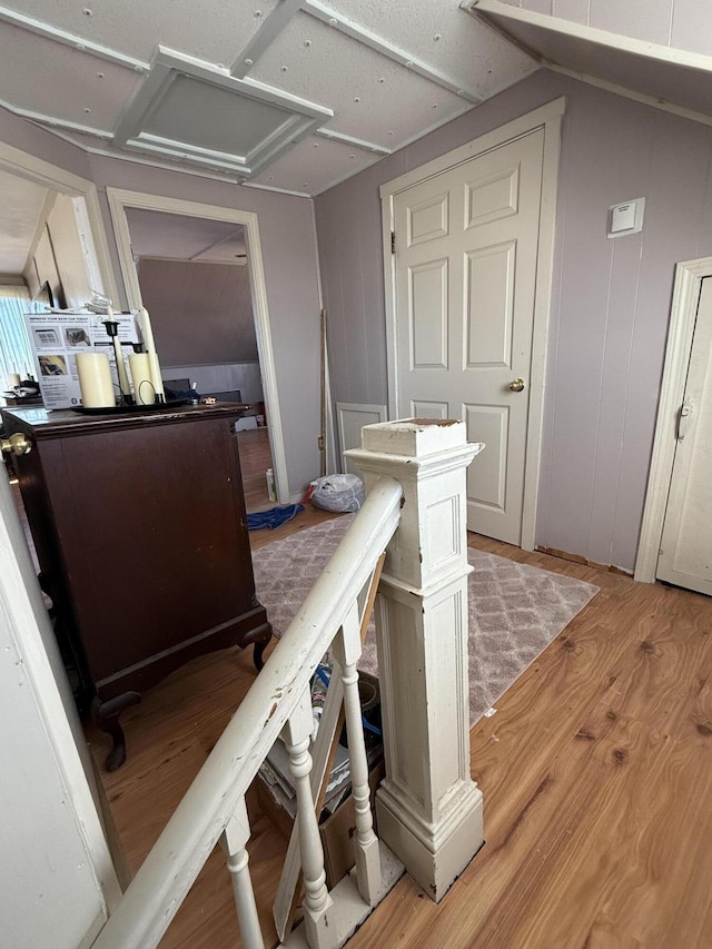 kitchen featuring vaulted ceiling and hardwood / wood-style flooring