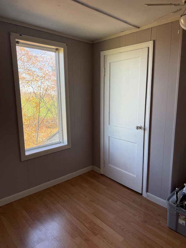 unfurnished bedroom featuring baseboards and wood finished floors