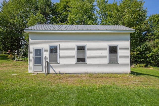 view of home's exterior with a yard