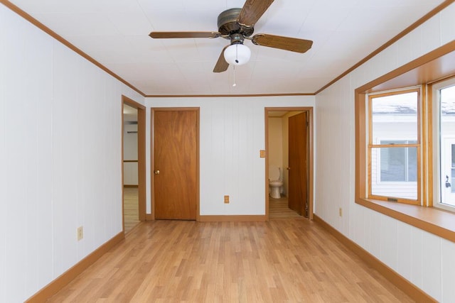 unfurnished bedroom with ceiling fan, light hardwood / wood-style flooring, connected bathroom, and crown molding