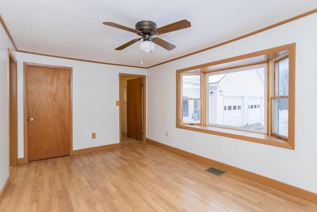 unfurnished bedroom featuring ceiling fan, light hardwood / wood-style flooring, and ornamental molding