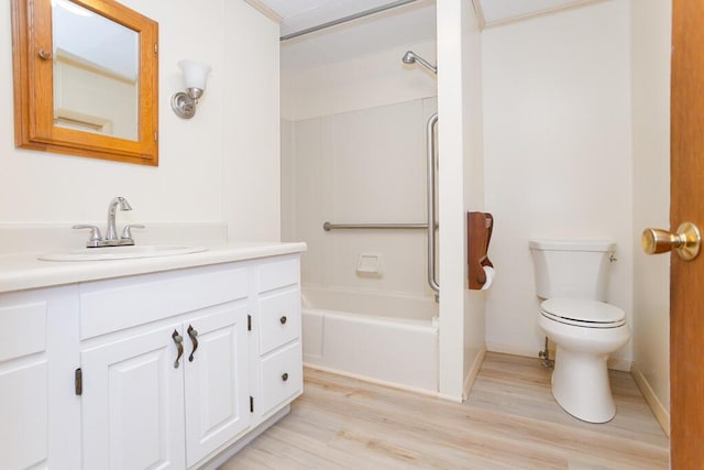 full bathroom featuring toilet, vanity, hardwood / wood-style floors, and  shower combination