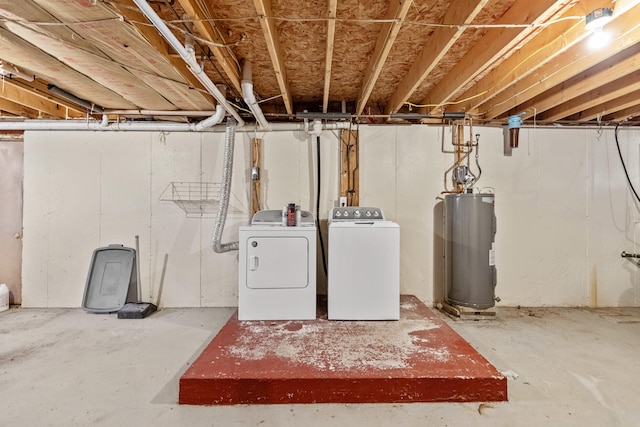 basement with electric water heater and washing machine and clothes dryer