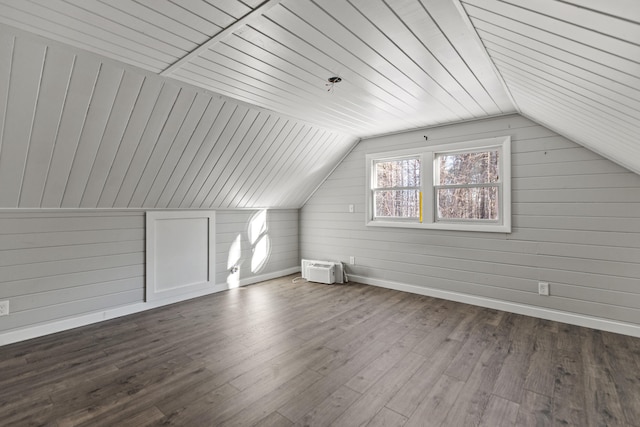 additional living space featuring wood ceiling, wooden walls, vaulted ceiling, and wood-type flooring