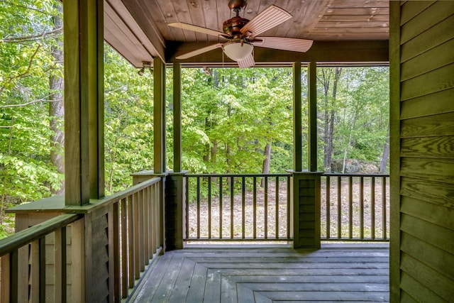 wooden deck featuring ceiling fan