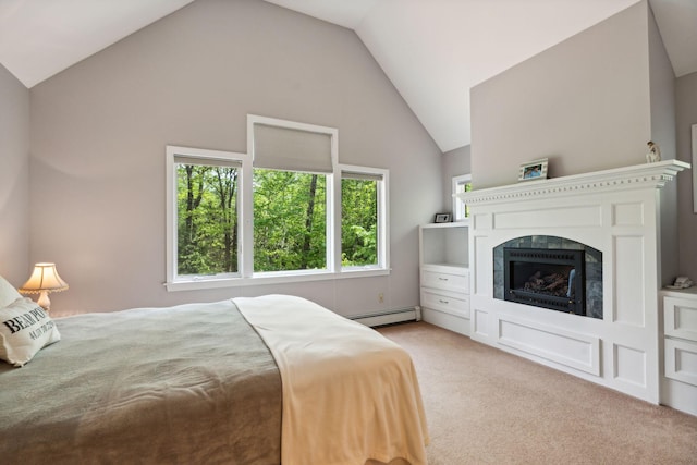 carpeted bedroom with a baseboard radiator, vaulted ceiling, and multiple windows