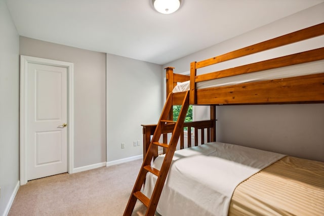 bedroom with light colored carpet