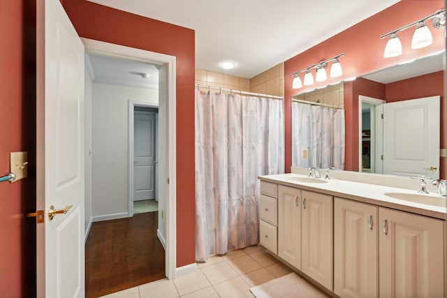 bathroom with tile patterned flooring and vanity