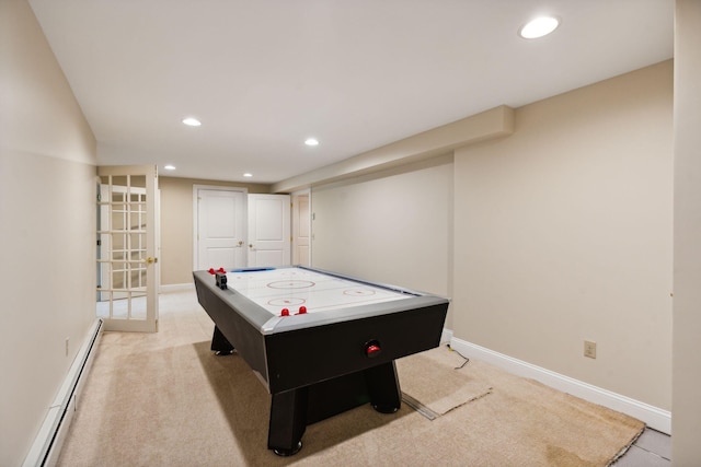 playroom featuring a baseboard radiator and carpet flooring