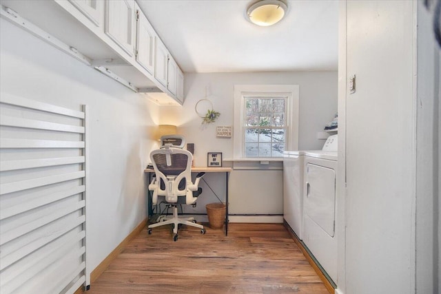 laundry area featuring washing machine and clothes dryer and hardwood / wood-style flooring