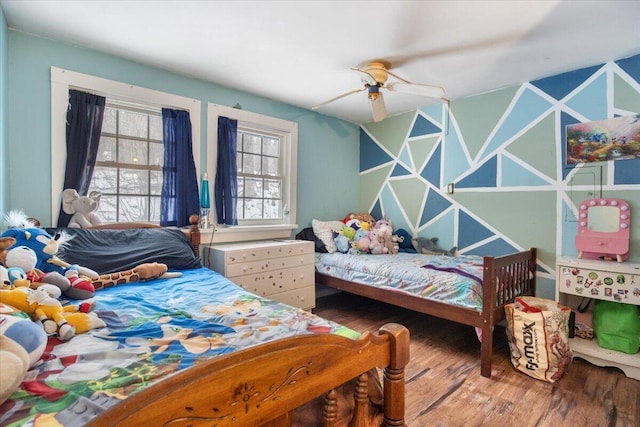 bedroom with hardwood / wood-style floors and ceiling fan