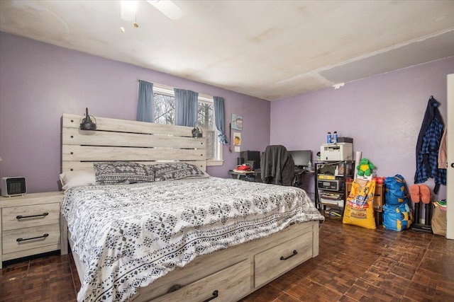 bedroom with dark parquet floors and ceiling fan