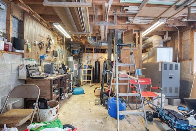 interior space with water heater and a workshop area