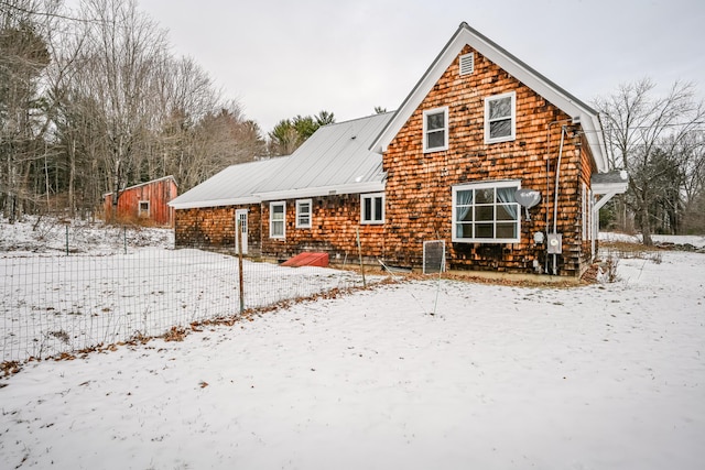 view of snow covered house