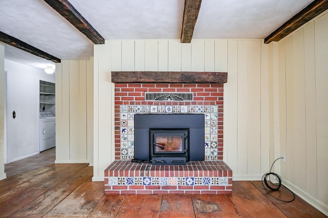 details with washer / dryer, wood walls, and beamed ceiling