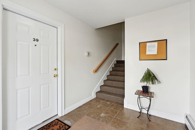 foyer entrance with baseboard heating