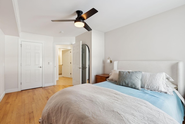 bedroom with ceiling fan and light hardwood / wood-style floors