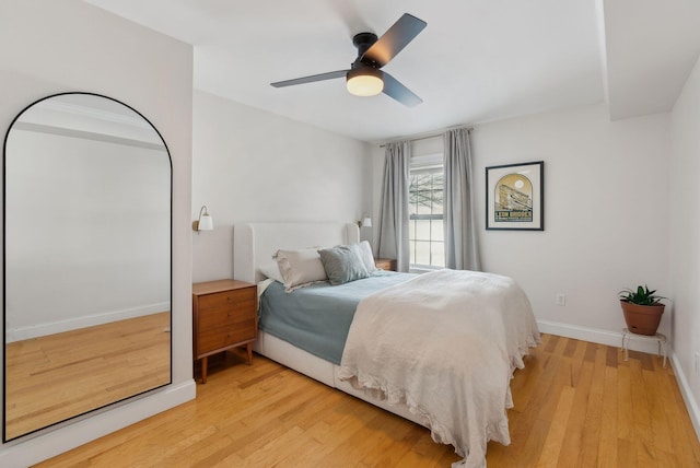 bedroom with ceiling fan and light hardwood / wood-style floors