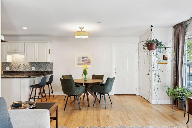 dining room with light hardwood / wood-style flooring